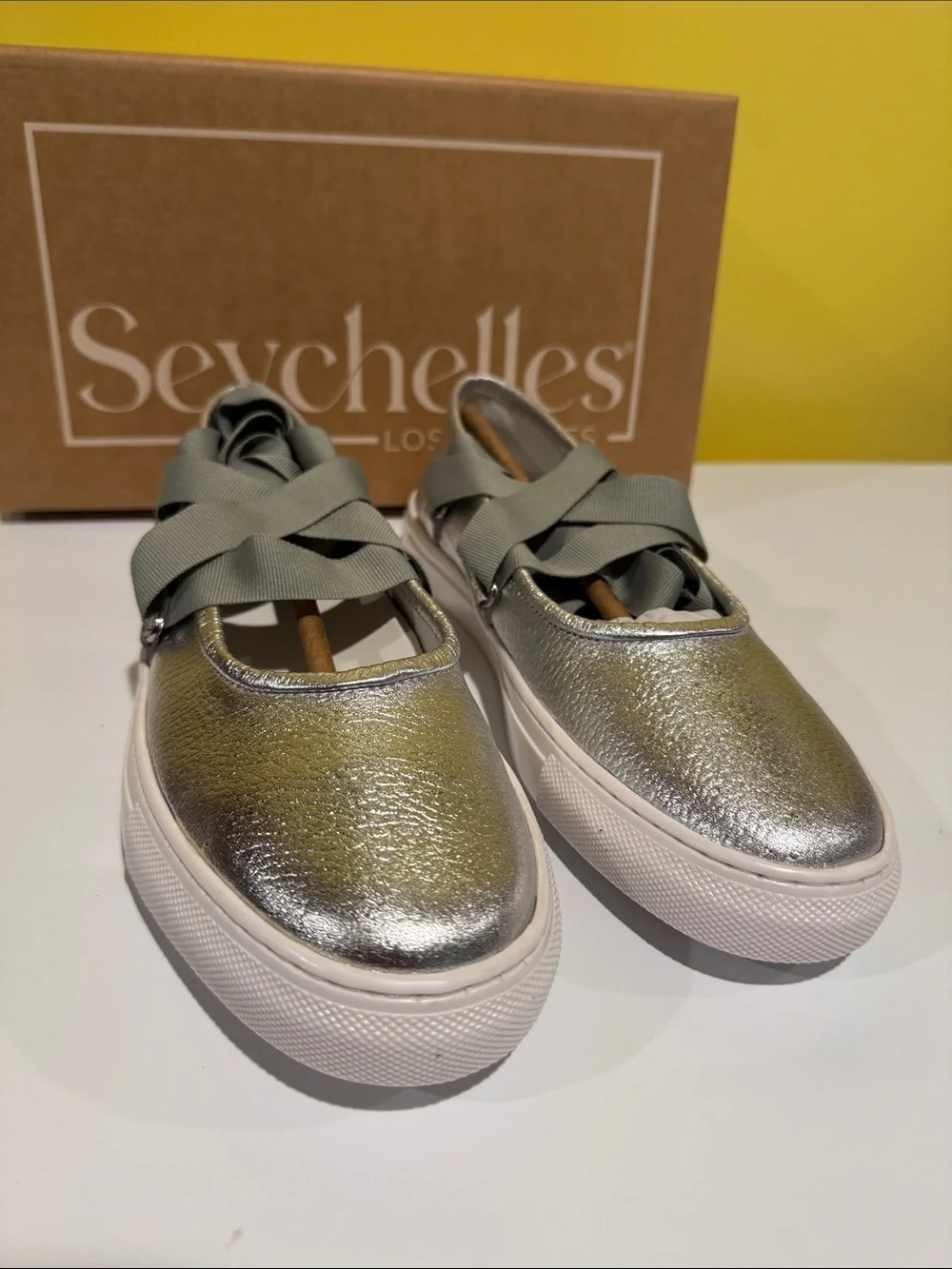 NIB Seychelles ribbons silver flats slip on .